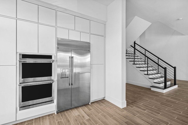 kitchen featuring white cabinets and appliances with stainless steel finishes