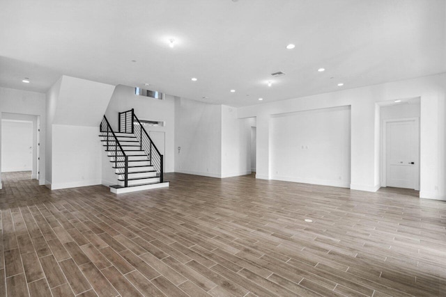 unfurnished living room with light wood-type flooring