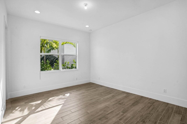 empty room featuring wood-type flooring