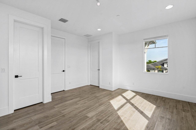 unfurnished bedroom featuring wood-type flooring