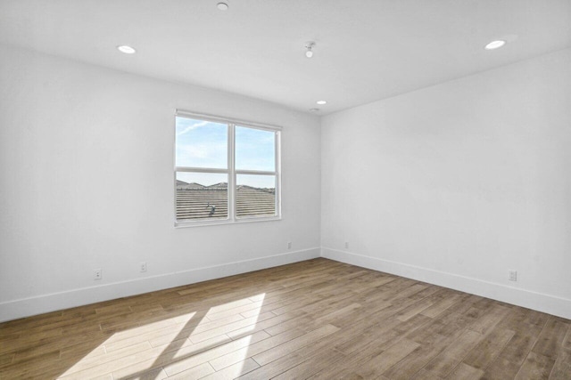 spare room with light wood-type flooring