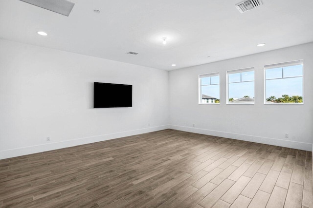 spare room featuring hardwood / wood-style floors