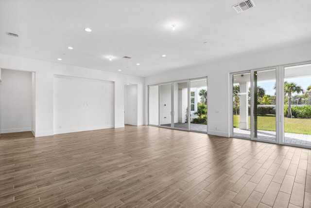 unfurnished room featuring dark wood-type flooring