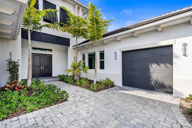 property entrance with a garage