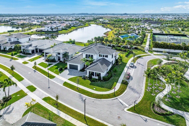 birds eye view of property with a water view