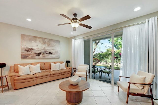 living area featuring recessed lighting, a ceiling fan, and light tile patterned floors