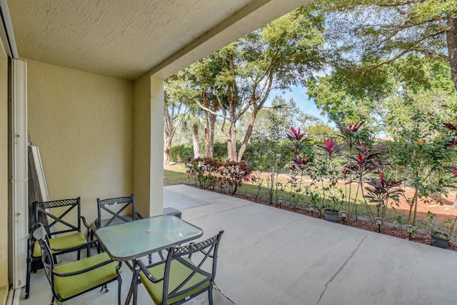 view of patio featuring outdoor dining area