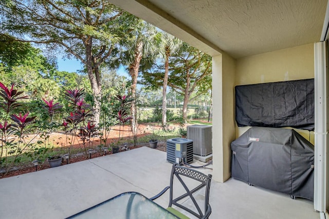 view of patio featuring central air condition unit and area for grilling