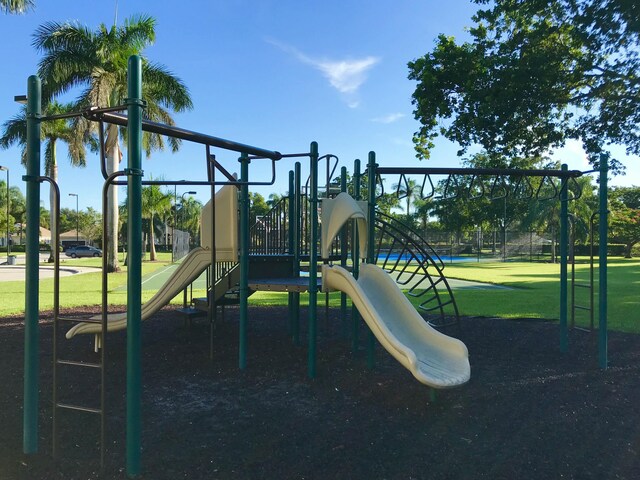 community playground featuring a yard