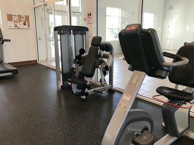 workout area with baseboards and visible vents