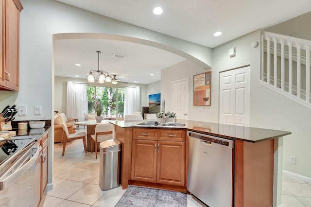 kitchen with visible vents, open floor plan, recessed lighting, arched walkways, and stainless steel appliances