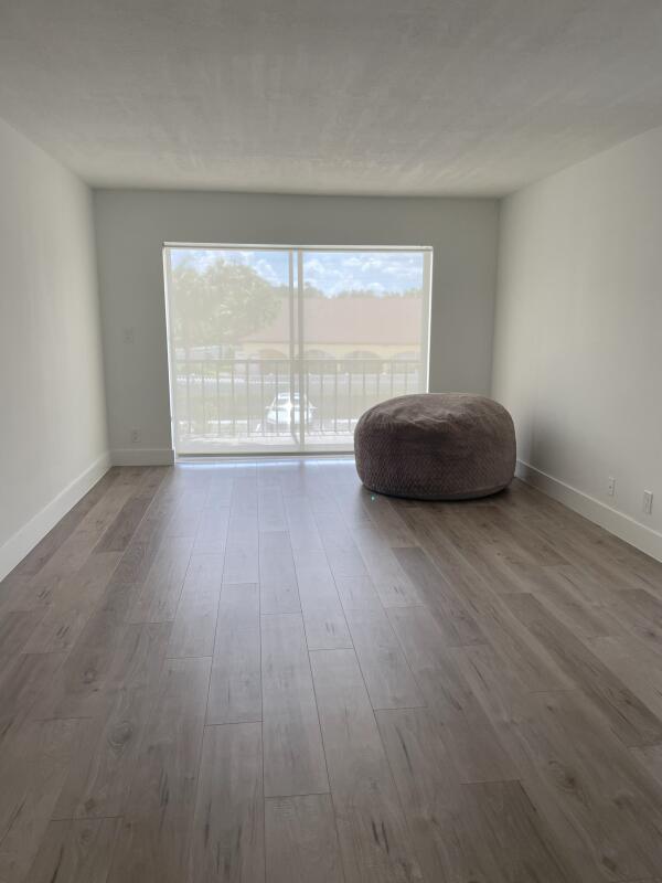 unfurnished room featuring wood-type flooring