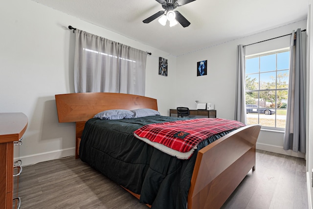 bedroom with ceiling fan and hardwood / wood-style floors