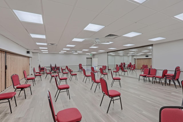 misc room featuring light hardwood / wood-style flooring, ceiling fan, and a paneled ceiling