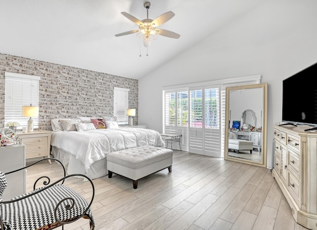 bedroom featuring light hardwood / wood-style flooring, high vaulted ceiling, and ceiling fan