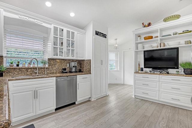 kitchen featuring sink, white cabinetry, dishwasher, stone counters, and light hardwood / wood-style floors