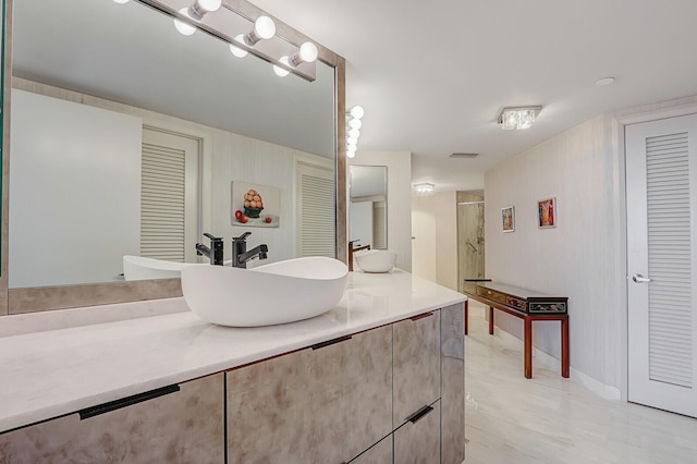 bathroom with vanity and an enclosed shower