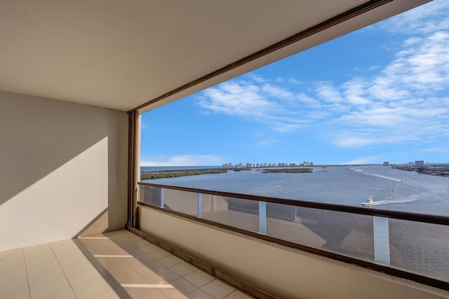 balcony featuring a water view