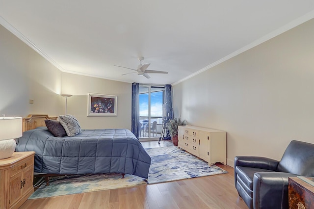 bedroom featuring ornamental molding, ceiling fan, and light hardwood / wood-style flooring