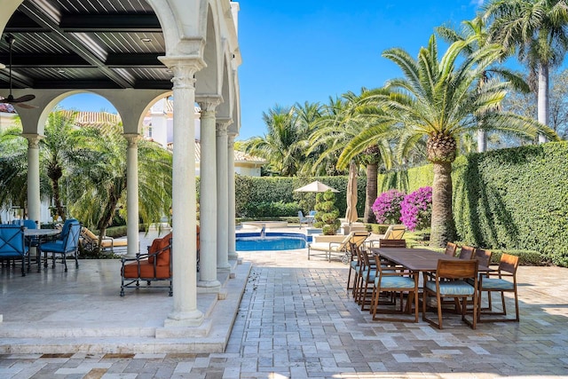 view of patio with a fenced in pool