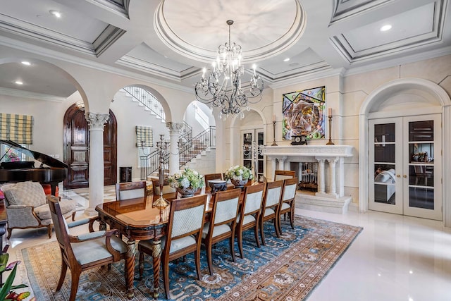 dining space featuring an inviting chandelier, decorative columns, coffered ceiling, ornamental molding, and french doors