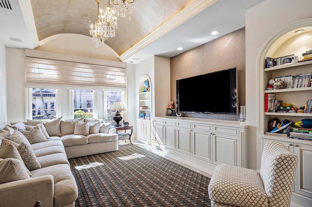 living room featuring lofted ceiling, carpet flooring, built in features, and an inviting chandelier