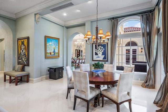 dining area featuring crown molding, an inviting chandelier, and light tile patterned floors