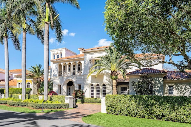 view of front of property with a balcony