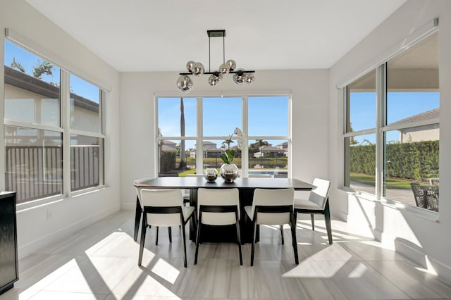 dining area featuring a notable chandelier and plenty of natural light