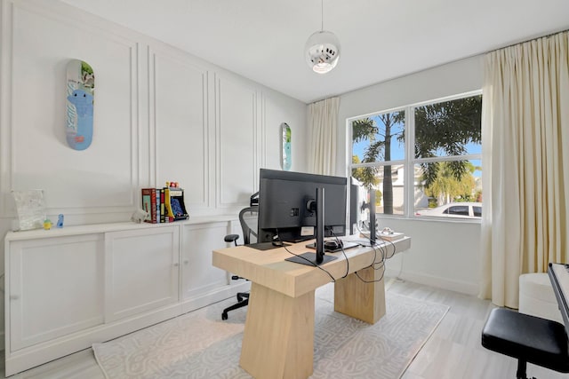 office space with light hardwood / wood-style floors