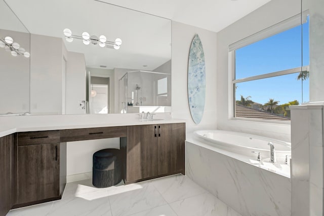 bathroom featuring vanity and shower with separate bathtub