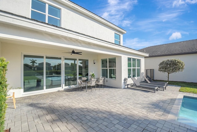 rear view of house featuring a patio and ceiling fan