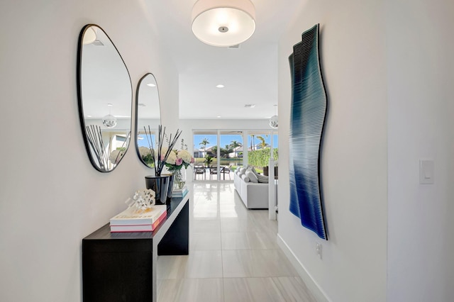 hallway featuring light tile patterned flooring