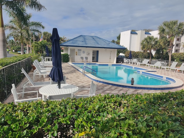 view of swimming pool with a patio area