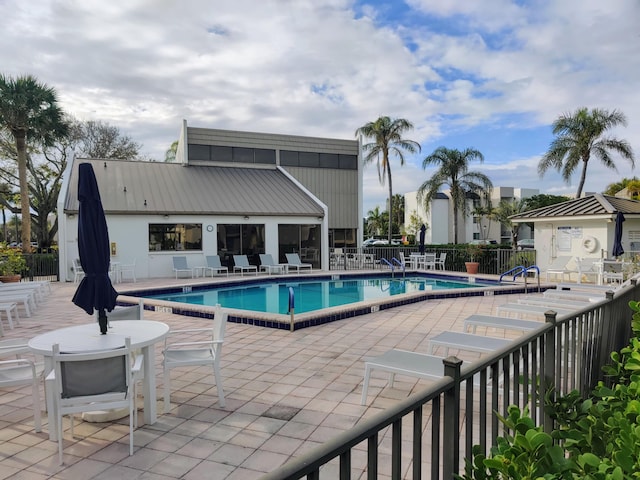 view of pool featuring a patio