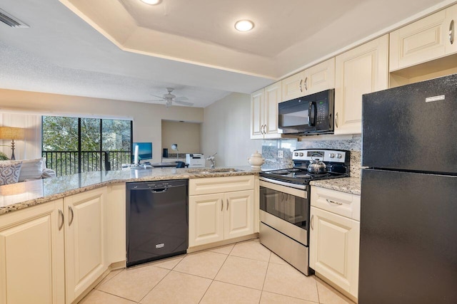 kitchen featuring sink, light tile patterned flooring, black appliances, kitchen peninsula, and light stone countertops