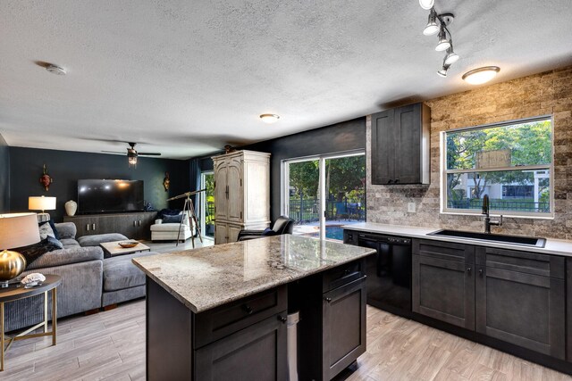 bar featuring decorative light fixtures, a chandelier, light hardwood / wood-style floors, and light stone countertops