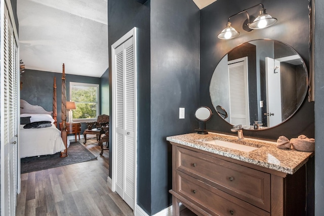 bathroom with vanity and hardwood / wood-style flooring