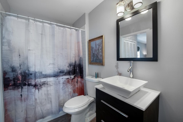 bathroom with vanity, toilet, and a shower with shower curtain