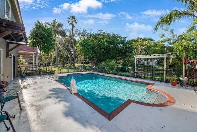 view of pool with a pergola and a patio area