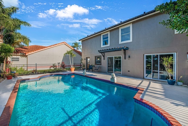 view of pool with a pergola and a patio area