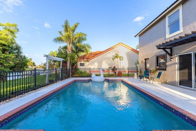 view of pool featuring a pergola and a patio area