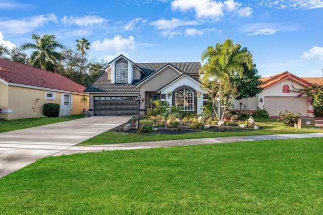 view of front facade with a garage and a front lawn