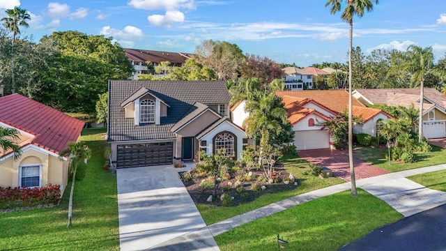 view of front of property with a garage and a front yard