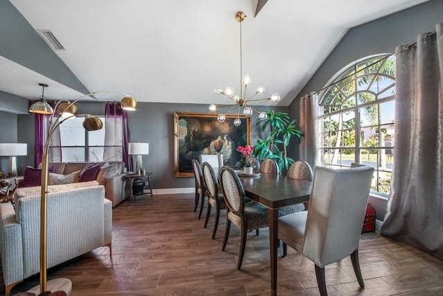 dining room featuring dark hardwood / wood-style flooring, vaulted ceiling, and a chandelier