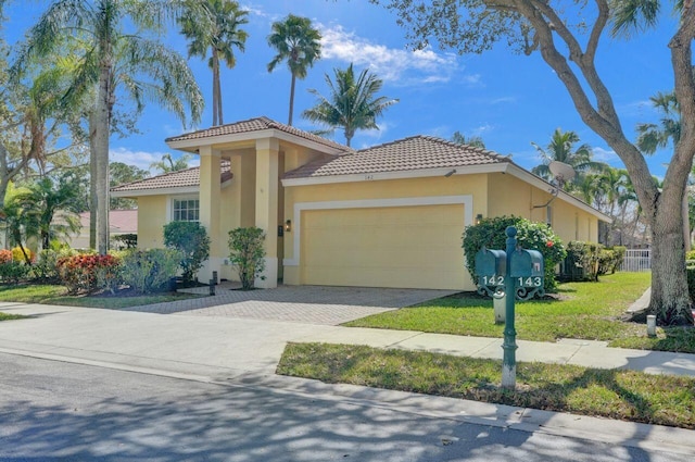 mediterranean / spanish-style home with a garage