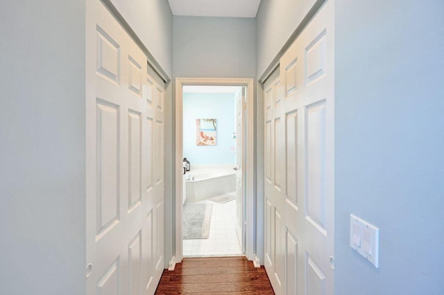 corridor with dark wood-type flooring