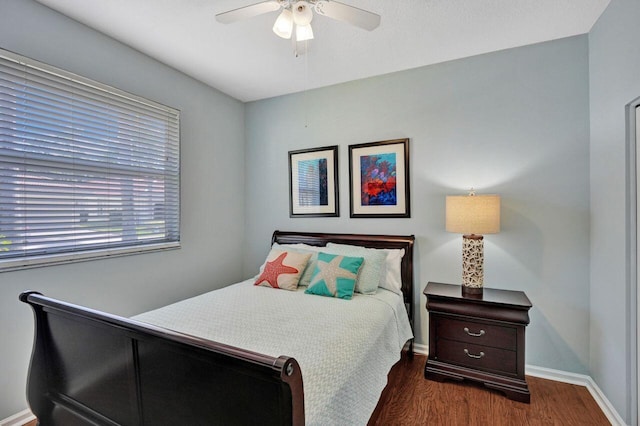 bedroom featuring dark wood-type flooring and ceiling fan