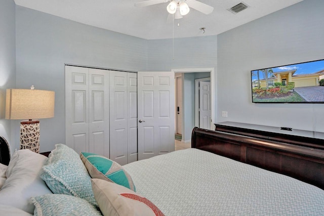 bedroom featuring ceiling fan and a closet