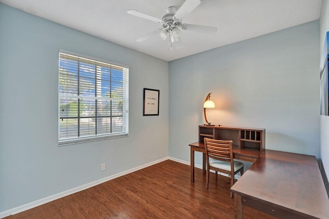 office with dark hardwood / wood-style floors and ceiling fan